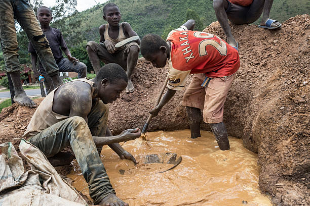 Artisanal gold miners process ore at an informal site, a practice at the centre of debates over safety, environmental protection and formalisation in the mining sector.