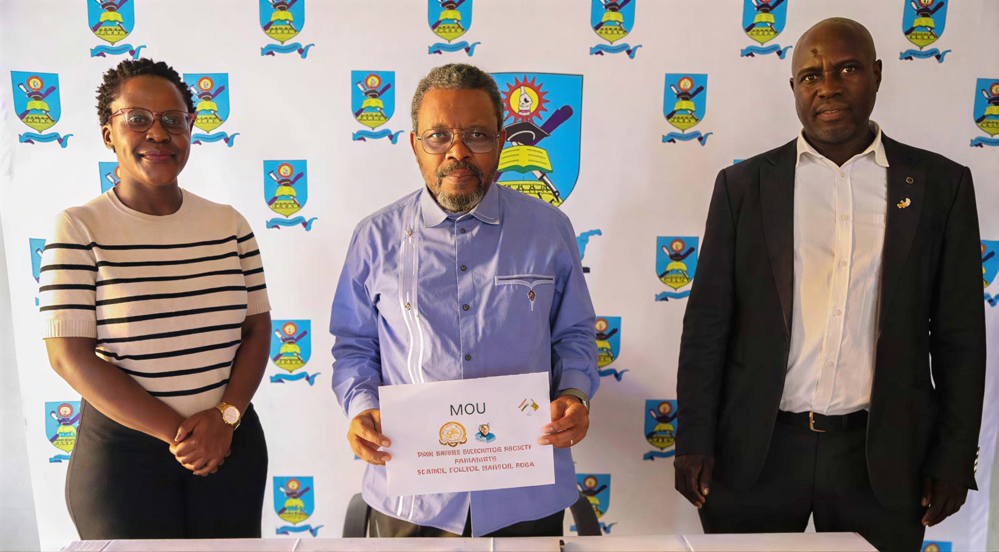 Professor Engineer William Goriwondo standing with colleagues at a formal MOU signing event