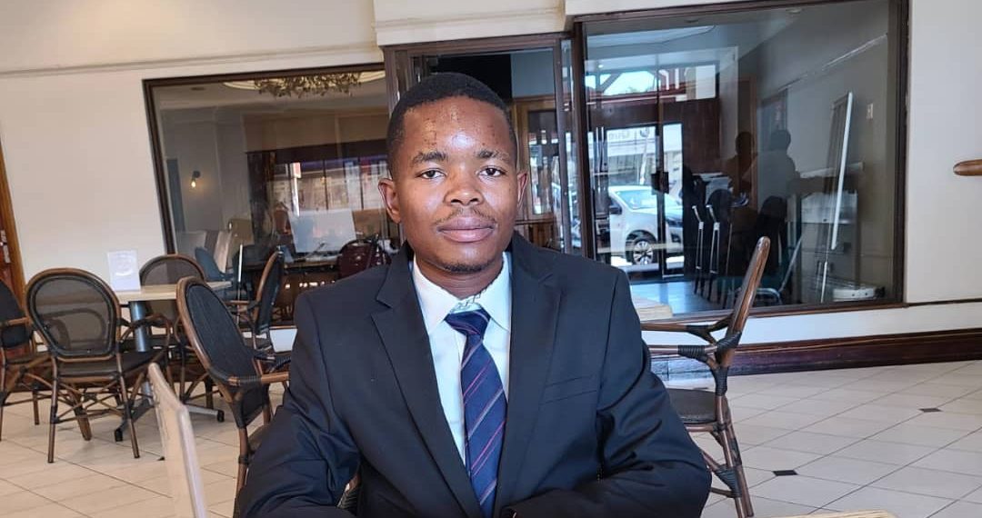 Nyasha Magadhi, chairman of Young Critical Minerals Producers of Zimbabwe, posing in his Harare office