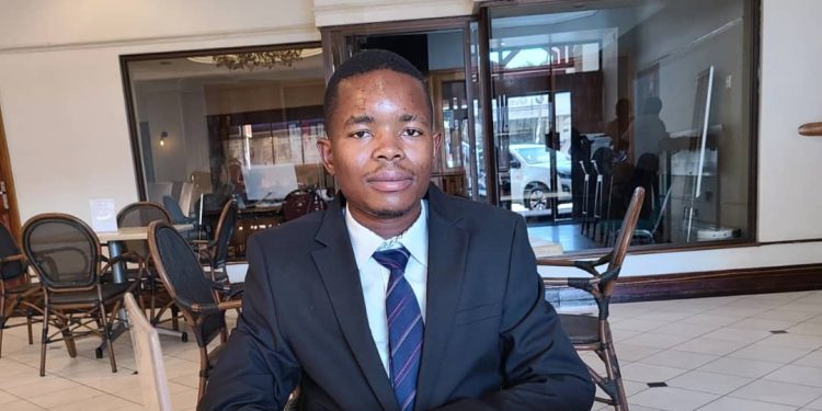 Nyasha Magadhi, chairman of Young Critical Minerals Producers of Zimbabwe, posing in his Harare office