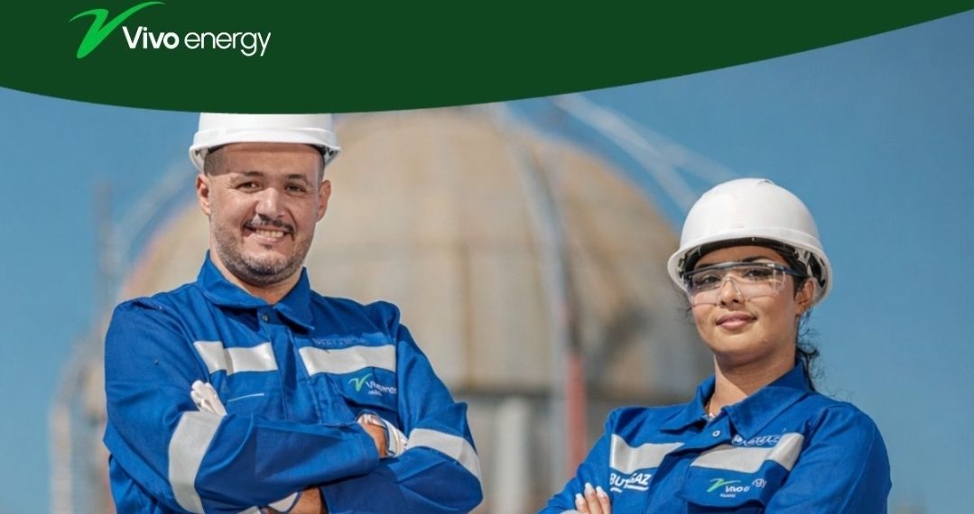 Vivo Energy employees wearing safety helmets and protective clothing at an energy facility.