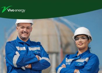 Vivo Energy employees wearing safety helmets and protective clothing at an energy facility.