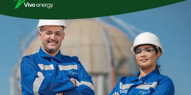 Vivo Energy employees wearing safety helmets and protective clothing at an energy facility.