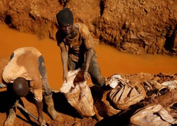 Artisanal gold miners work at a shallow open-pit mine in rural Zimbabwe.