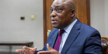 Reserve Bank of Zimbabwe Governor John Mushayavanhu gestures during a meeting, discussing suspension of the foreign currency retention policy for small-scale gold miners.