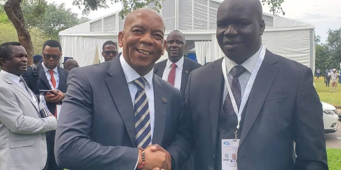 Dr Edzai Kachirekwa shakes hands with South Africa Electricity and Energy Minister Dr Kgosientsho Ramokgopa at an energy conference in Cape Town.