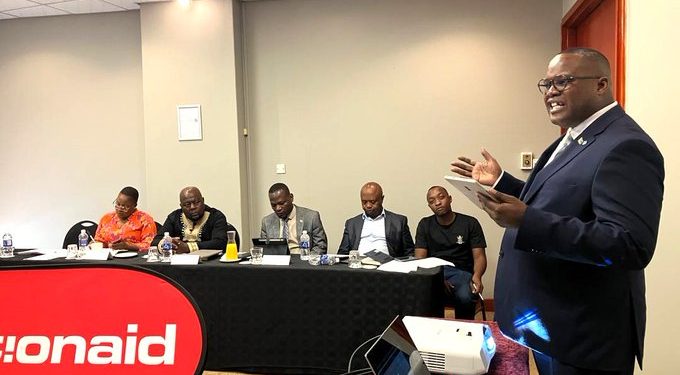 Committee Chairperson Caston Matewu addresses attendees during a breakfast meeting on accountability in state-linked mining enterprises.