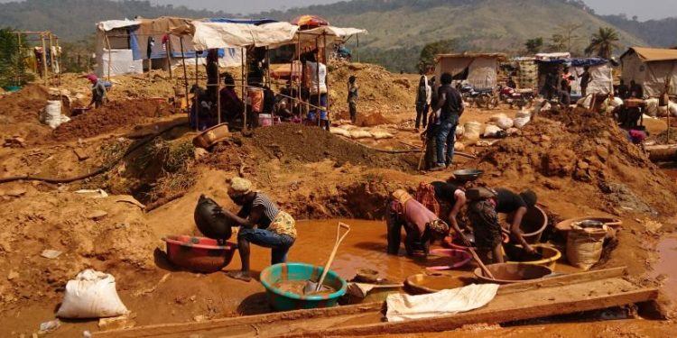 Artisanal miners working at a small-scale mining site.