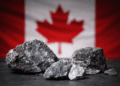 Rare earth mineral ore samples in front of a Canadian flag