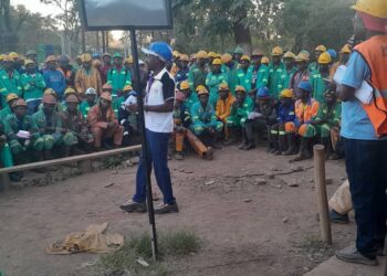 Mine workers in Zimbabwe listen to union officials during a gathering.