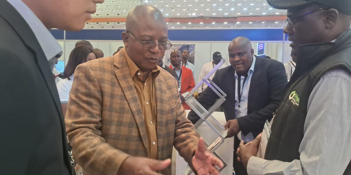 Zimbabwe's Mines Minister Dr Polite Kambamura speaks with exhibitors during a tour of Mine Entra in Bulawayo.