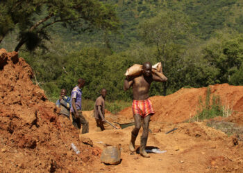 Illegal artisanal gold miners work at an open mine in Mazowe, Zimbabwe