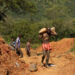 Illegal artisanal gold miners work at an open mine in Mazowe, Zimbabwe