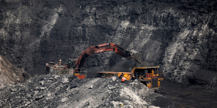 File photo of a loader loading coal onto a truck at Topa coal mine, Ramgarh district, Jharkhand, India