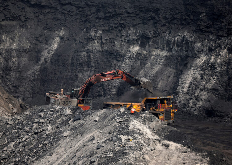 File photo of a loader loading coal onto a truck at Topa coal mine, Ramgarh district, Jharkhand, India