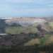 Aerial view of SA Lithium Mine in Magog, South Africa, bordered by farmland threatened by mining expansion