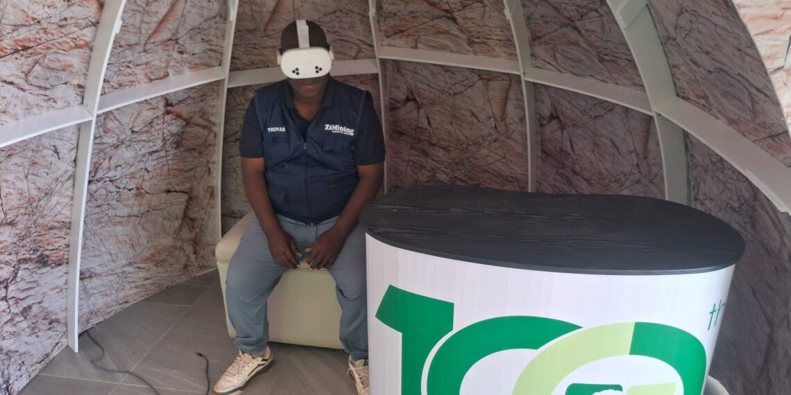 ZiMining editor Thomas Chidamba wears a VR headset inside a geodesic dome display at the Mimosa Mine stand, Zimbabwe Agricultural Show, August 26, 2026.