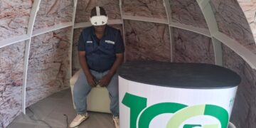 ZiMining editor Thomas Chidamba wears a VR headset inside a geodesic dome display at the Mimosa Mine stand, Zimbabwe Agricultural Show, August 26, 2026.