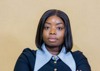 Eng. Gloria Gawe Bususu poses for a professional portrait with arms crossed.