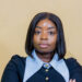 Eng. Gloria Gawe Bususu poses for a professional portrait with arms crossed.