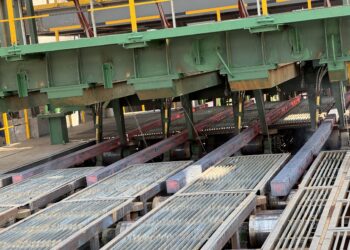 Freshly cast square steel billets move along rollers inside Dinson Iron and Steel Company's steel plant in Manhize, Zimbabwe.
