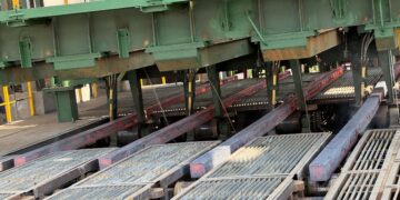 Freshly cast square steel billets move along rollers inside Dinson Iron and Steel Company's steel plant in Manhize, Zimbabwe.