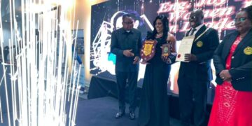 Engineer Charity Chenai Chigwada receives an award at the Zimbabwe Institution of Engineers Annual Dinner.
