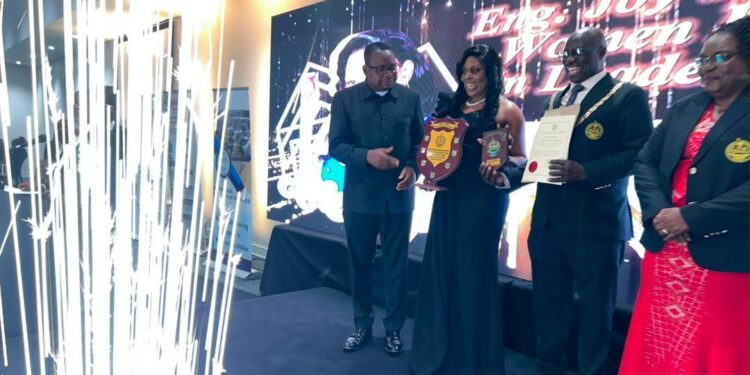 Engineer Charity Chenai Chigwada receives an award at the Zimbabwe Institution of Engineers Annual Dinner.
