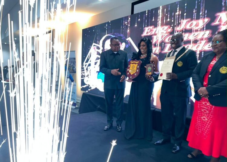 Engineer Charity Chenai Chigwada receives an award at the Zimbabwe Institution of Engineers Annual Dinner.
