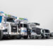 Lineup of CiDi autonomous mining trucks, buses and industrial vehicles displayed with company branding.