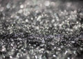 Annealed neodymium iron boron magnets in a barrel, prior to being crushed into powder