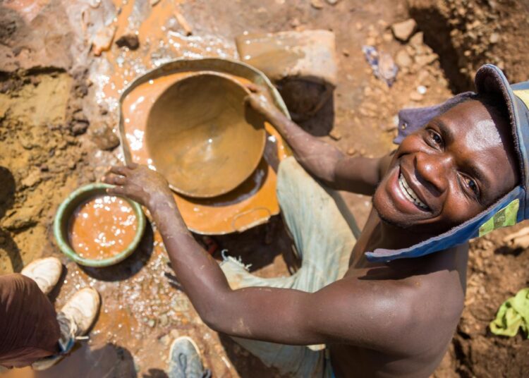 Artisanal gold miners work at a mine site in Makaha, Mudzi.