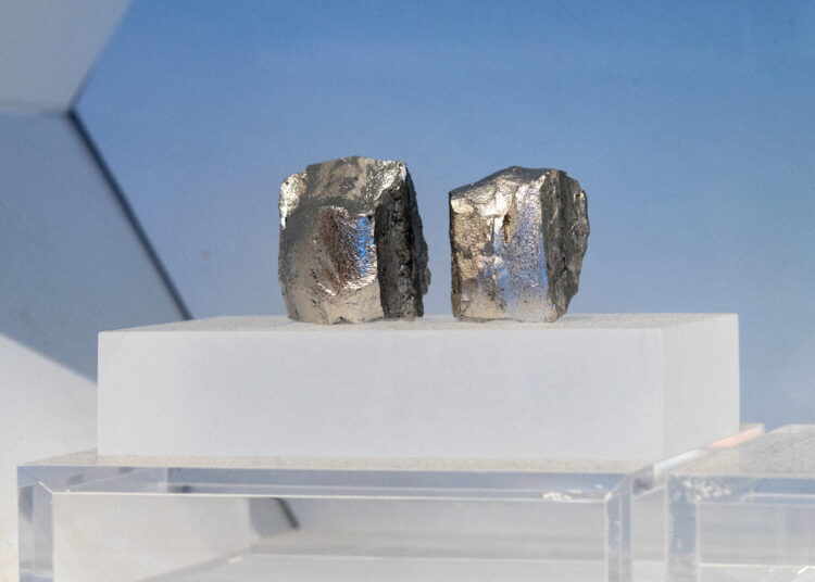 Hydrogen‑storage alloy ingots are displayed in the rare earth elements production section of the exhibition on China’s manufacturing achievements, in Beijing
