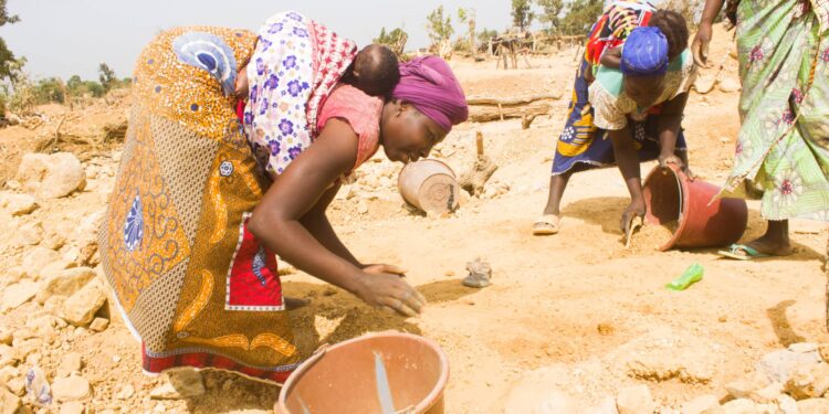 Artisanal women miners work at a small-scale mining site in Zimbabwe.