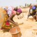 Artisanal women miners work at a small-scale mining site in Zimbabwe.