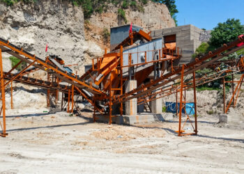 Aggregate screening conveyors and processing equipment at a Zhongji crushing and screening plant.